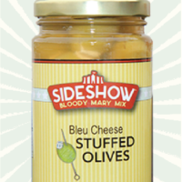 A jar of blue cheese stuffed olives.